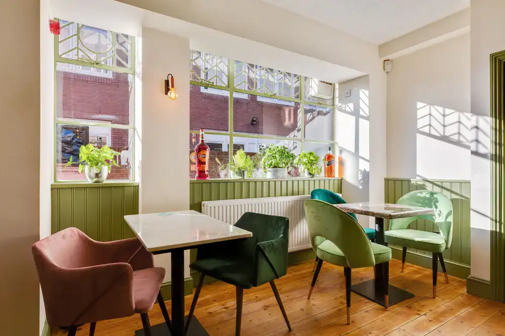 A bright, welcoming studio space with comfortable seating and natural light