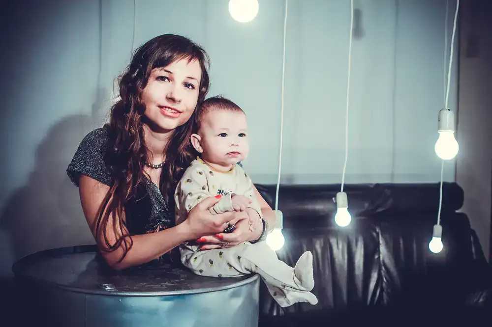 A softly lit family portrait in an airy studio setting