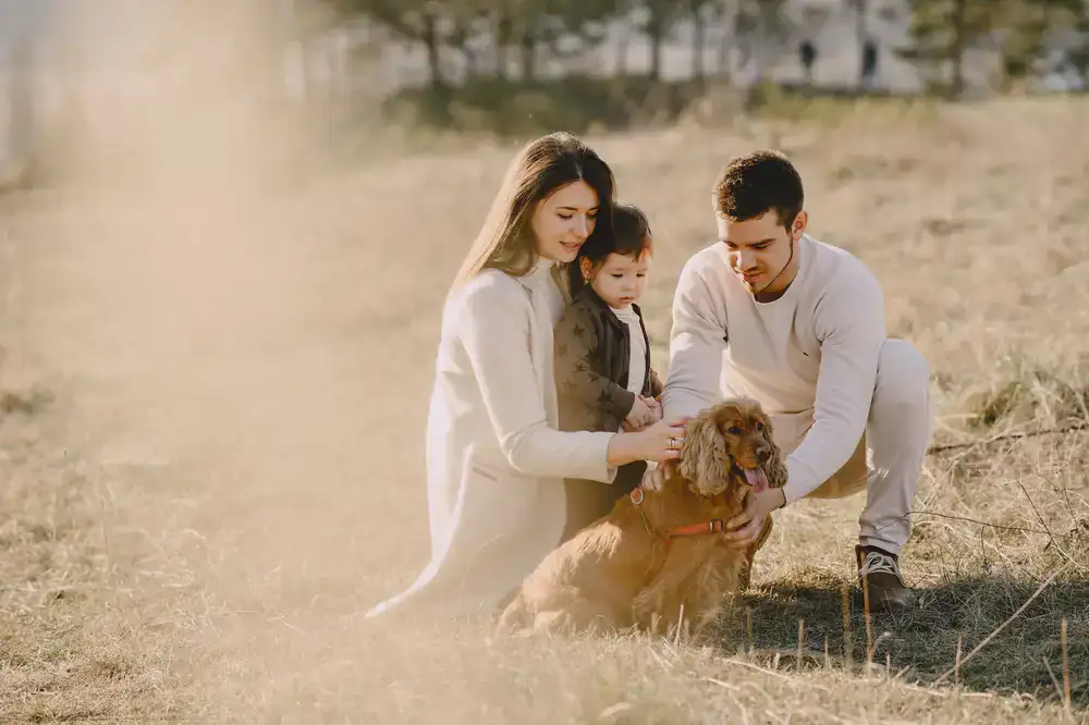 A family of four walking closely together outdoors