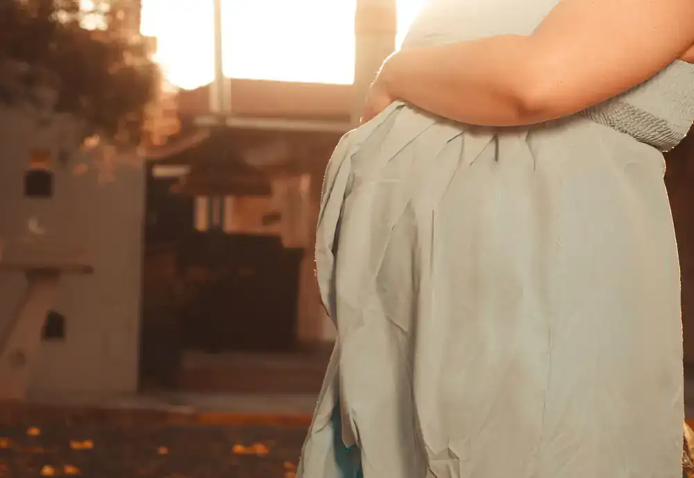 Gentle maternity portrait using natural window light