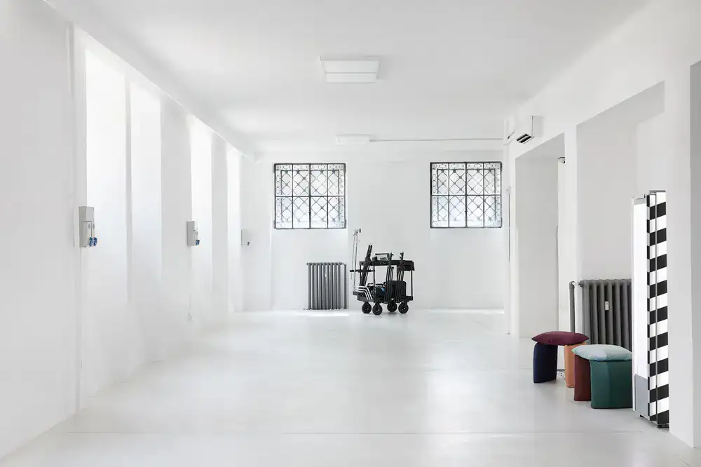 Wide shot of the bright, airy photography studio space