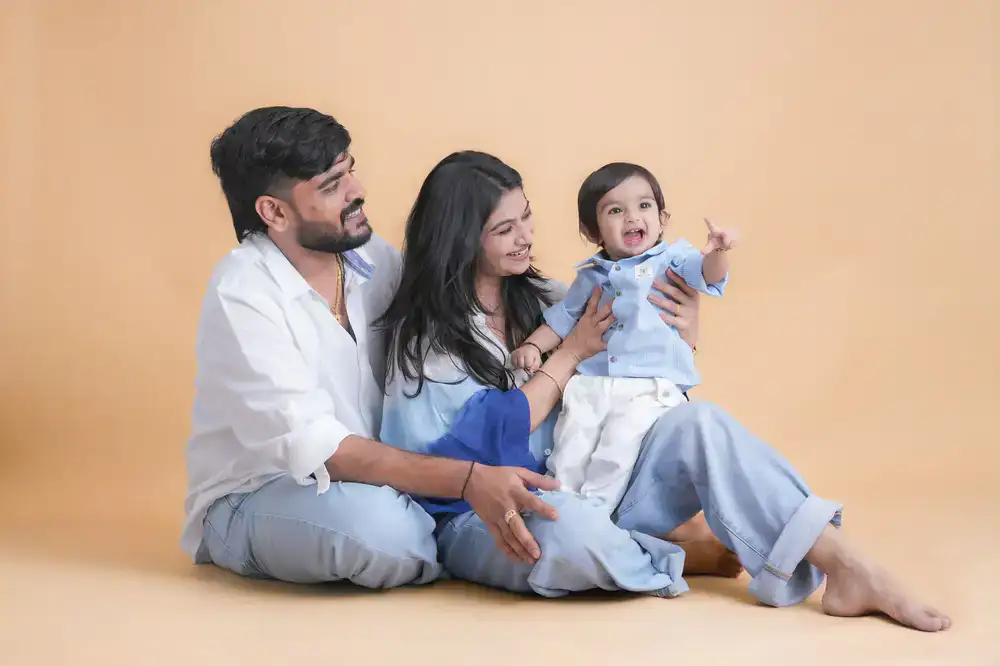 Mother and child sitting in natural light during a studio session